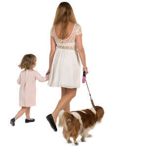 mother and daughter walking with a dog