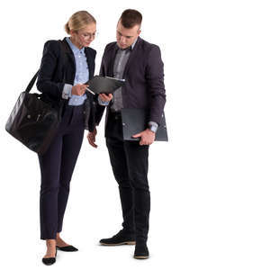 businessman and businesswoman standing and looking at papers