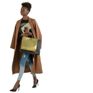 black woman with shopping bags walking