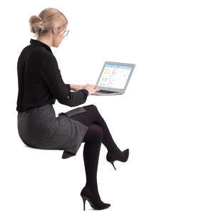 woman sitting at an office table and working
