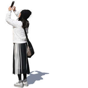 woman standing and taking a picture