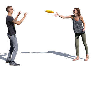 man and woman playing frisbee on a sunny day