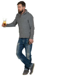 man standing at a bar counter and drinking beer