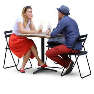 couple sitting in a cafe and drinking ice coffee