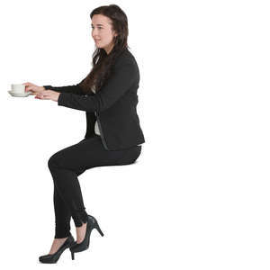 woman sitting at a counter and drinking coffee