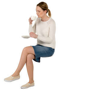 woman sitting in a cafe and drinking coffee