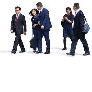 group of asian businessmen and businesswomen walking