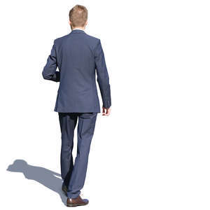 young man in a suit walking