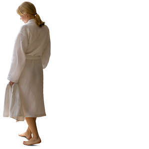 woman in a white bathrobe walking