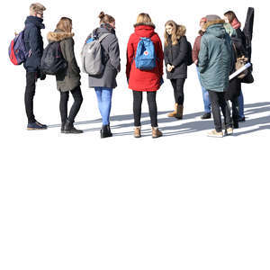 group of young people standing and talking