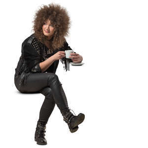 woman with big hair sitting in a cafe