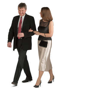 couple in fancy clothes walking arm in arm