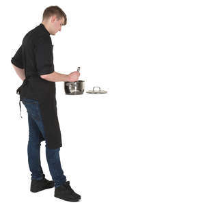 man standing in a kitchen and cooking
