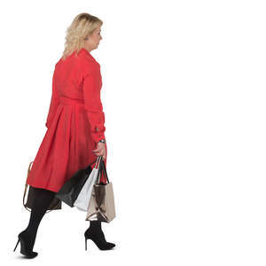 woman in a red dress carrying shopping bags walking