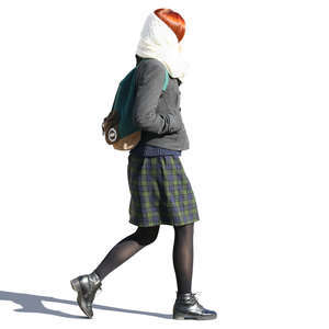woman with a large scarf walking