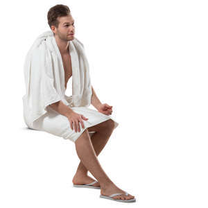 man in a spa towel sitting