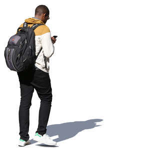 man walking and looking at his phone