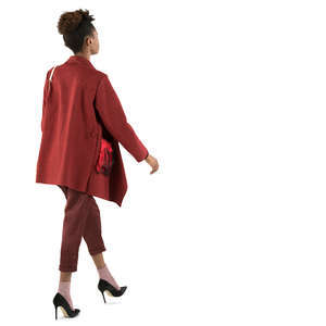 african woman in a red costume walking