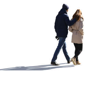 backlit couple walking
