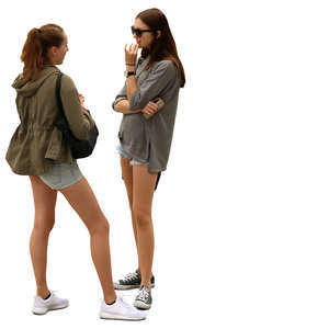 two young women standing and talking