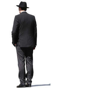 man with a black hat and suit standing
