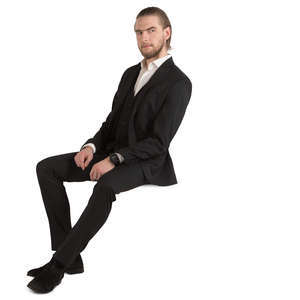 man in a black suit sitting