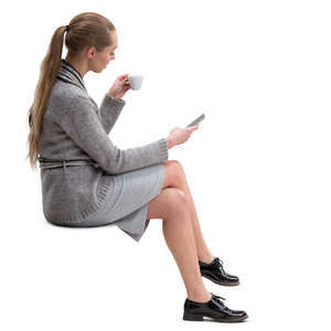 woman sitting and drinking coffee