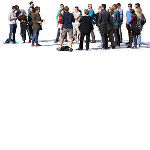 group of people standing and listening to a guide