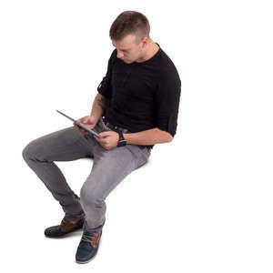 man sitting with a tablet seen from above