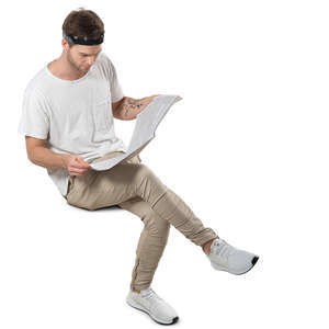man sitting and reading seen from above