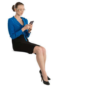 office worker sitting and looking at her phone