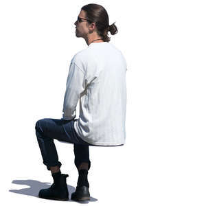 young man sitting in sunlight