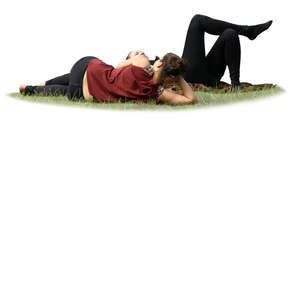 two women lying on the grass in a park