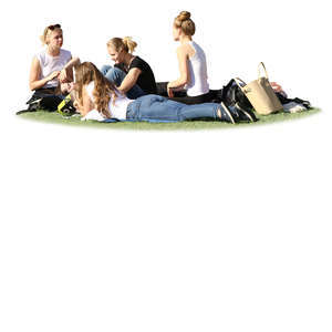 group of young women relaxing in the park