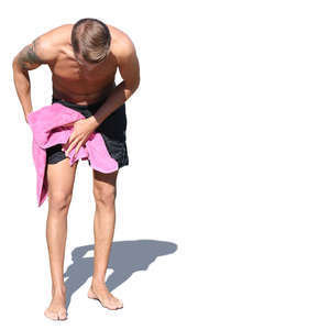 man drying himself after swimming
