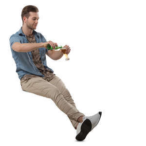 man sitting in a cafe and drinking beer