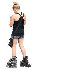 girl with rollerblades standing and looking at her phone