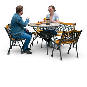 man and woman sitting at a terrace table and drinking coffee