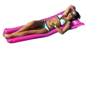 woman sunbathing on a pool mattress seen from above