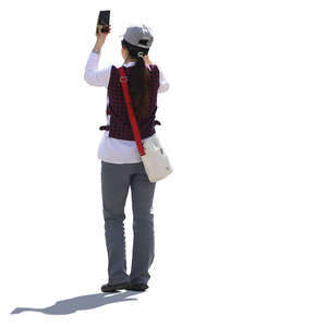 asian woman standing and taking a picture