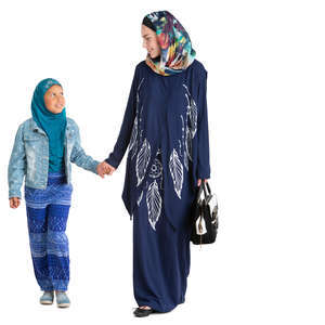 muslim woman walking with her daughter hand in hand