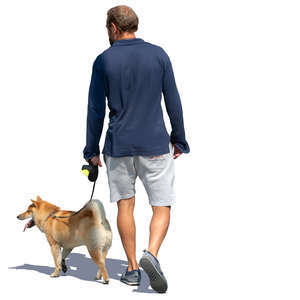 man walking a dog in the summer