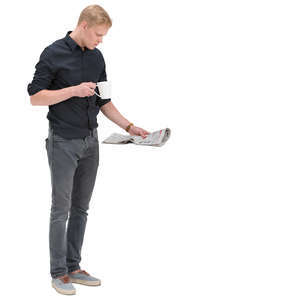 man with a cup of coffee standing and reading a newspaper