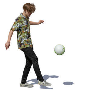 teenage boy juggling a soccer ball