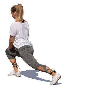 woman in sports outfit stretching her legs