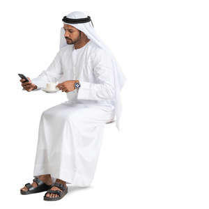 arab man sitting in a cafe