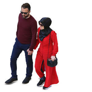 muslim couple walking hand in hand seen from above