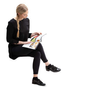 woman sitting and reading a magazine