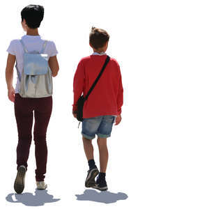 backlit mother and son walking