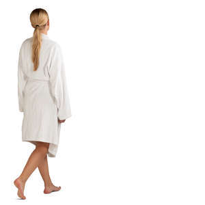 barefoot woman in a white bathrobe walking 